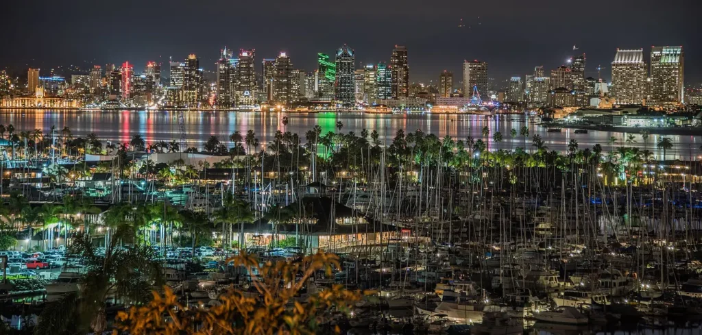 Downtown San Diego, California skyline at night, looking west across the San Diego Yacht Club and San Diego Bay