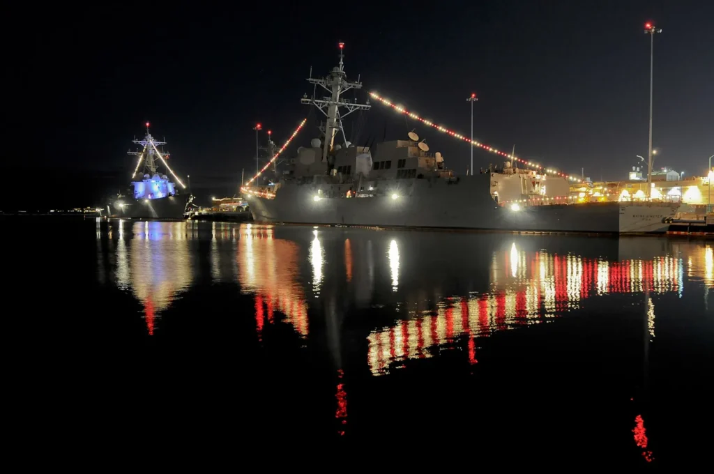 Navy ships decorated with Christmas lights in San Diego Bay