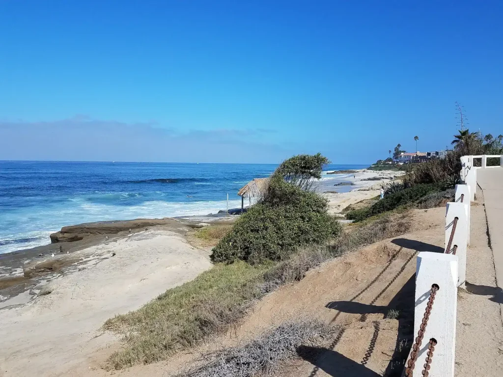 Path and sandy cove at Windansea Beach on a sunny day