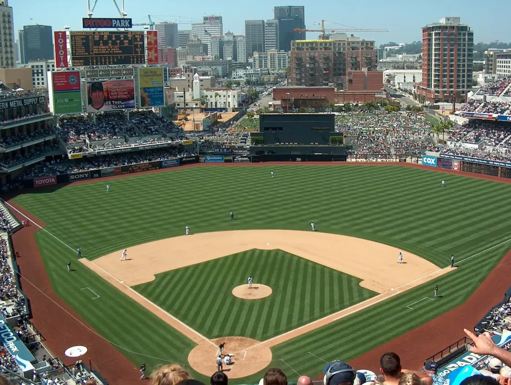 The interior of Petco Park with the San Diego skyline in the background