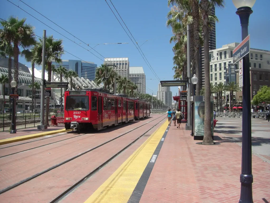 Red San Diego Trolley car on a downtown street