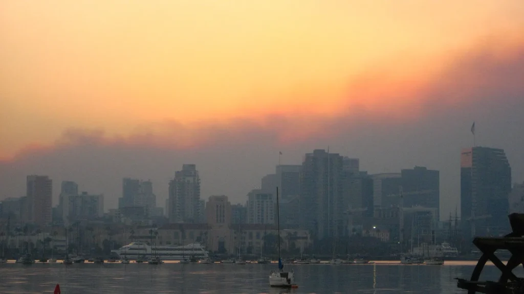 San Diego Events This Weekend: San Diego skyline in front of smoke from wildfires, sunrise