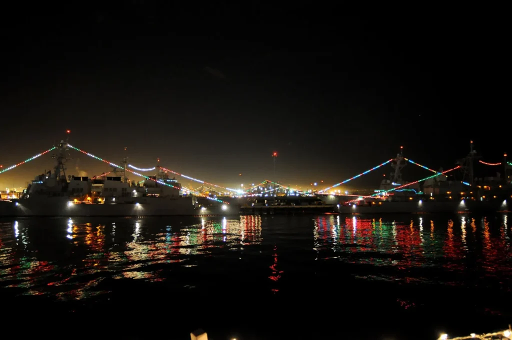 Ships at Naval Base San Diego display lights for a holiday festivity